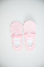 A pair of BellaForm ballet-laced grip socks in Ballet Pink, laid flat on a pale background with satin ribbons wrapped around the arch.